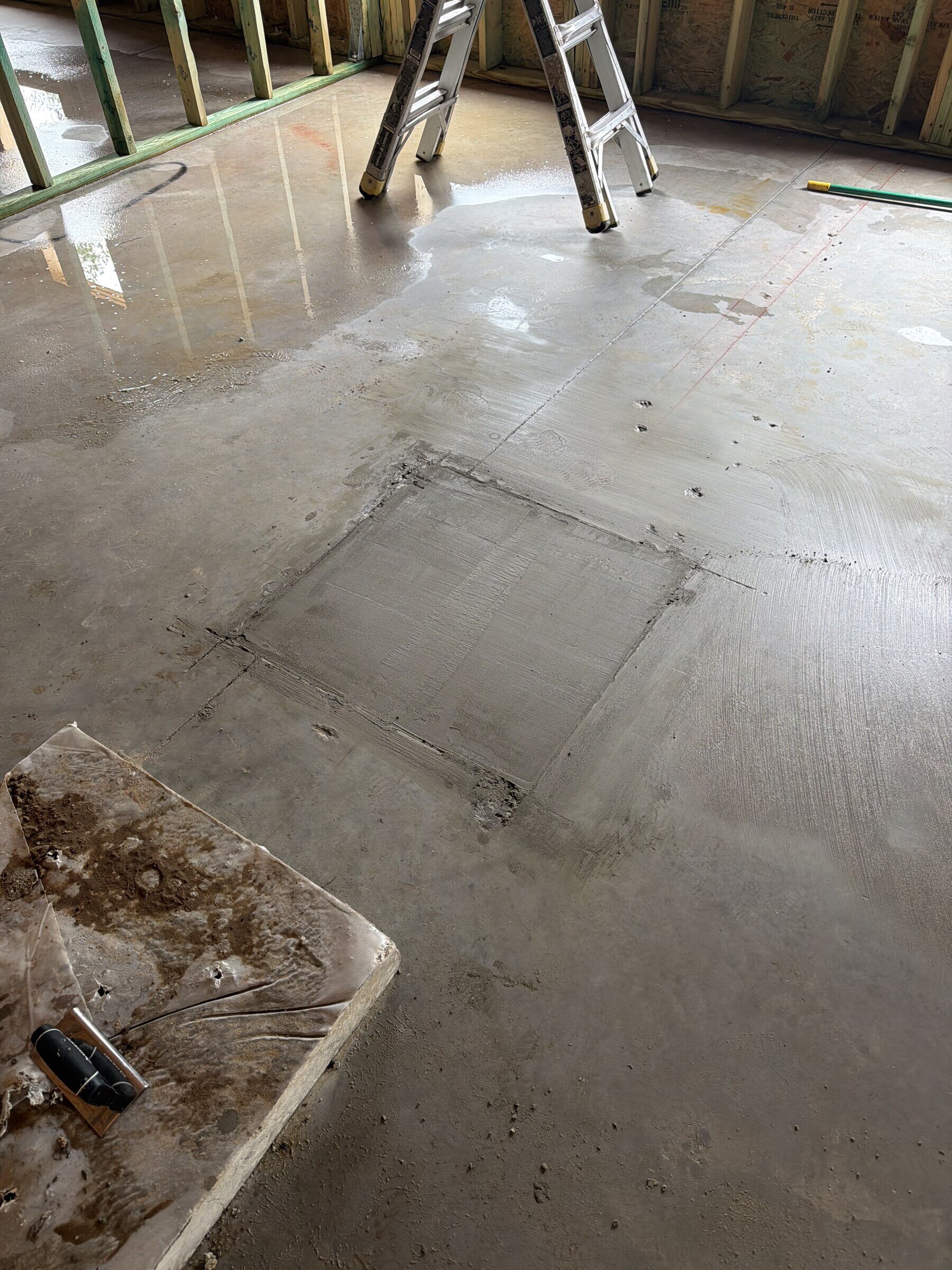 Concrete placement and slab preparation detail during a Flagler Estates custom-home build